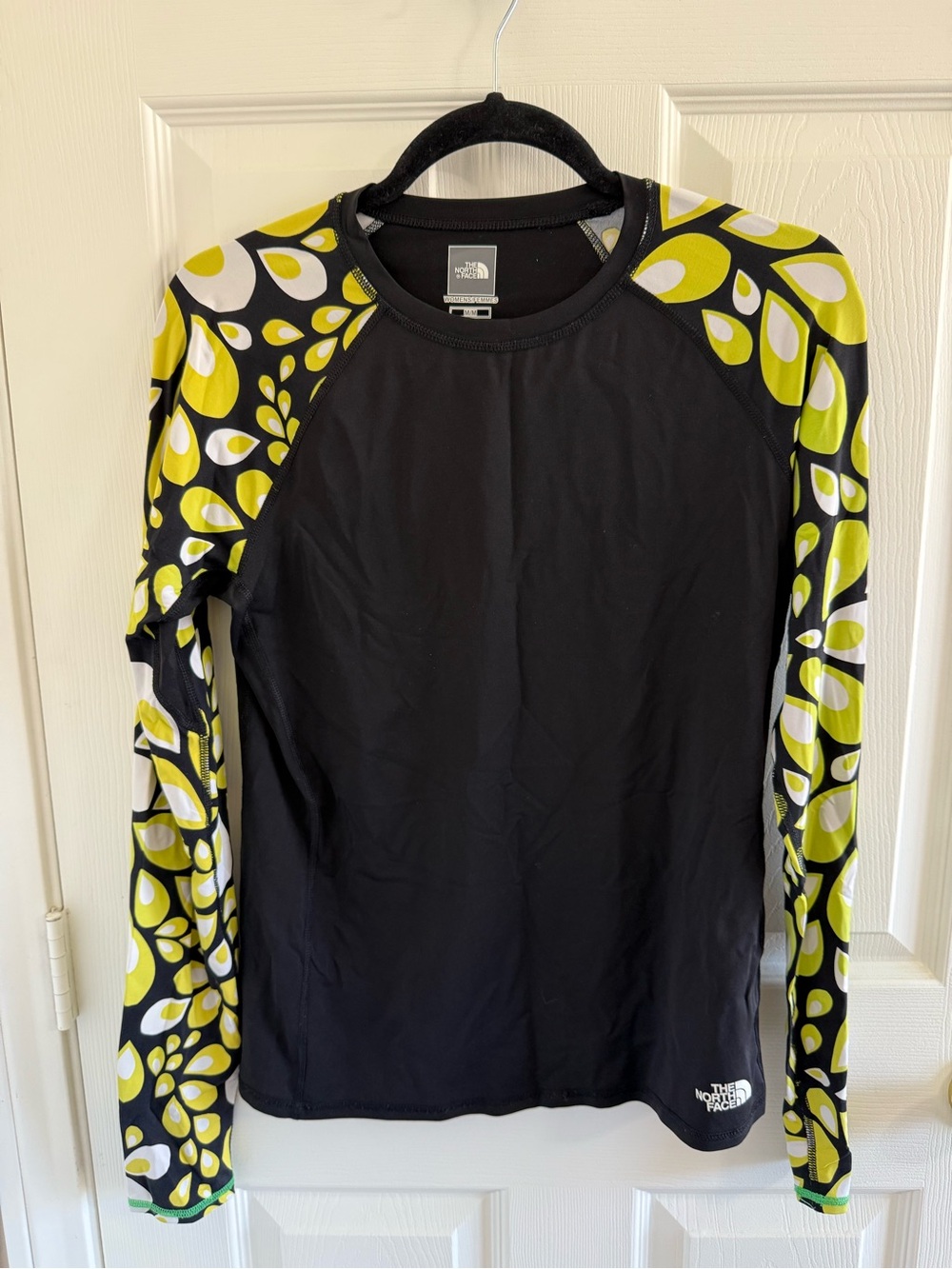 The North Face Black Rash Guard with Yellow and White Patterned Sleeves